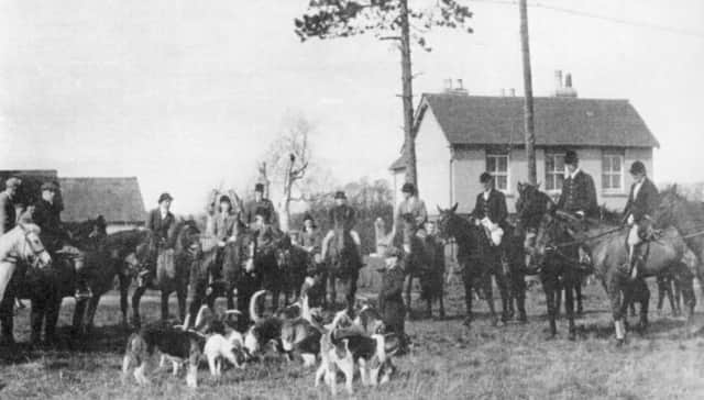 The hounds from Stockheath Naval camp  gather with hunters on Stockheath common. To the  left rear is part of the, now demolished, Cricketers Tavern.