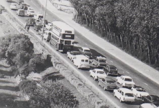 WAIT Southbound traffic on Northern Road, Cosham, in the early 1960s 			   Picture: Barry Cox Collection