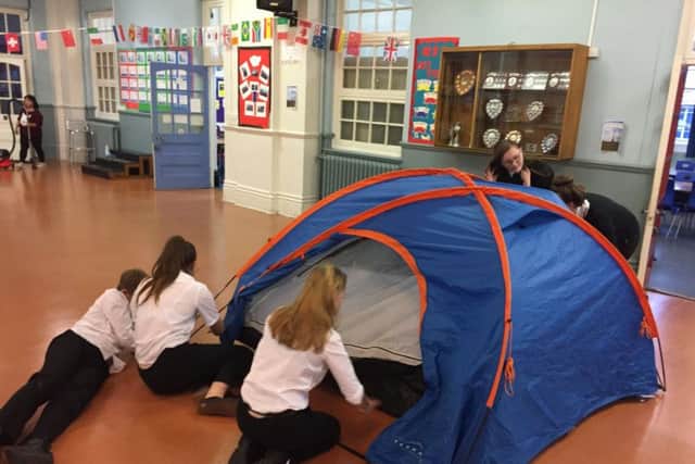 Priory School students get to grips with putting up a tent
