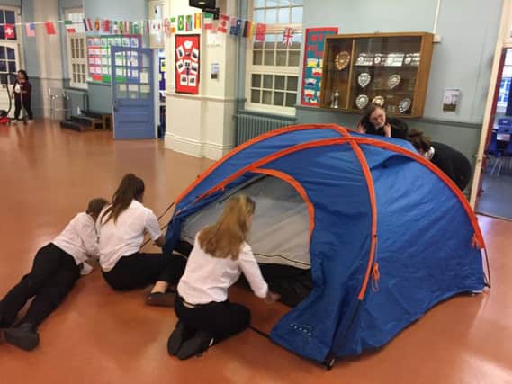 Priory School students get to grips with putting up a tent
