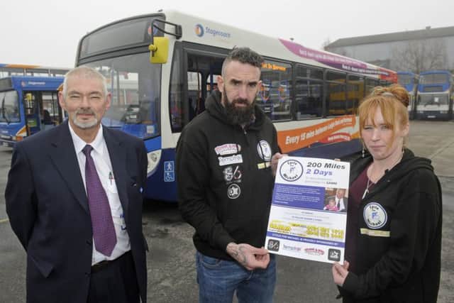George Gibson, left, from Stagecoach with Eugene Scardifield and his sister Becky Roe-Stacey who have been allowed to place fundraising posters in buses in memory of their brother Michael Scardifield who was murdered. Picture Ian Hargreaves (170214-1)