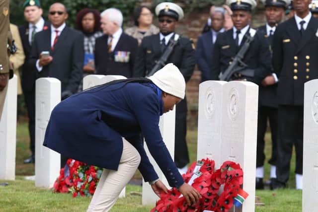 Family members laying wreath near the graves