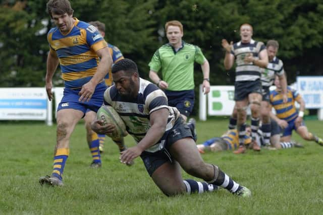 Jerome Trail injured his shoulder going over for a try
