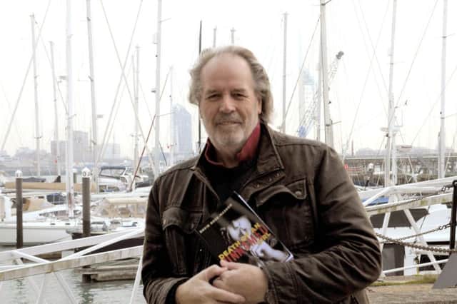 Author David Rose-Massom with his first book