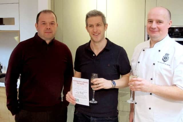 Mark Judges, centre, with his first place certificate