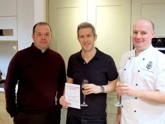 Mark Judges, centre, with his first place certificate
