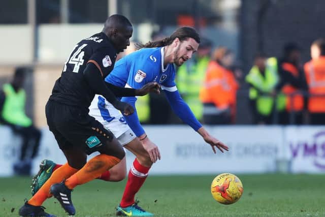 Pompey defender Christian Burgess battles for the ball with Barnet's Simeon Akinola Picture: Jordan Cross