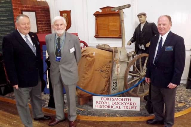 Members of the society in front of an exhibit. Nigel Linger, Robert Russell and John Regnard