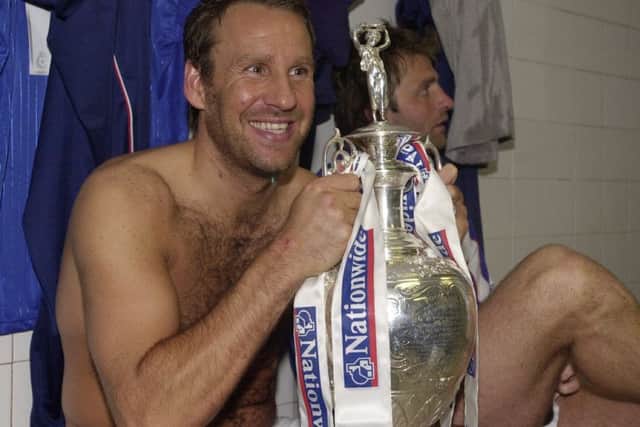 Paul Merson with the Division One championship trophy