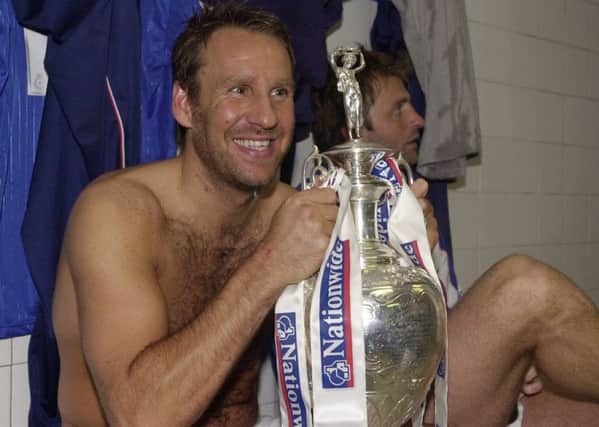 Paul Merson with the Division One championship trophy