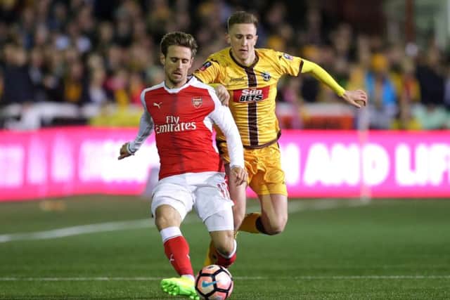 Pompey youngster Adam May, right, in FA Cup action for Sutton United against Arsenal