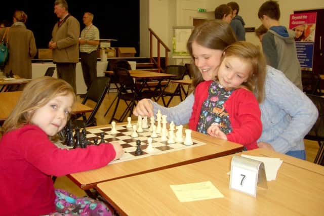 From left, Ella Rose, five, Emily Rose, five, and Louise Rose, 13. The Sir William Dupree & Phyllis Loe Chess Tournament, taking place at Portsmouth High School in April, is aimed at young people of all ages.CAPTION: From left, Ella and Emily Rose, five, and Louise Rose, 13.