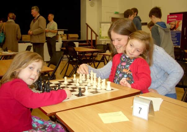 From left, Ella Rose, five, Emily Rose, five, and Louise Rose, 13. The Sir William Dupree & Phyllis Loe Chess Tournament, taking place at Portsmouth High School in April, is aimed at young people of all ages.

CAPTION: From left, Ella and Emily Rose, five, and Louise Rose, 13.