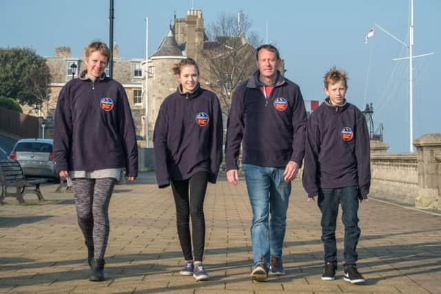 gosport 50-mile charity walk50-mile charity walk launched in Gosport mums memoryPictured: Helen Bulbeck from Brainstrust is pictured at Trinity Landing, Isle of Wight, with Jon Jones and his children, 14-year-old Adrienne and 12-year-old Isaac.The family of a Gosport woman who died of a brain tumour in 2016 have helped the Isle of Wight-based charity she supported to launch a two-day, 50-mile fundraising walk around the island. Jon Jones, his 14-year-old daughter Adrienne and 12-year-old son Isaac, from Lee-on-Solent, Gosport, joined Helen Bulbeck, co-founder and director of services at brainstrust, to launch the charitys third Follow the Seagulls two-day walk, which starts on 1 April and will cover a 50-mile route around the Isle of Wight. Mum Jo Jones, who was diagnosed with a brain tumour in 2010, took part in the 2016 Follow the Seagulls walk. She died last summer. Adrienne Jones said: "Mum really enjoyed the walk. It was a challenge for all of us, but it felt good afterwards. I w