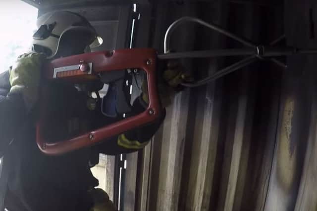 A firefighter using a high pressure lance. Credit: Chief Fire Officers Association/YouTube