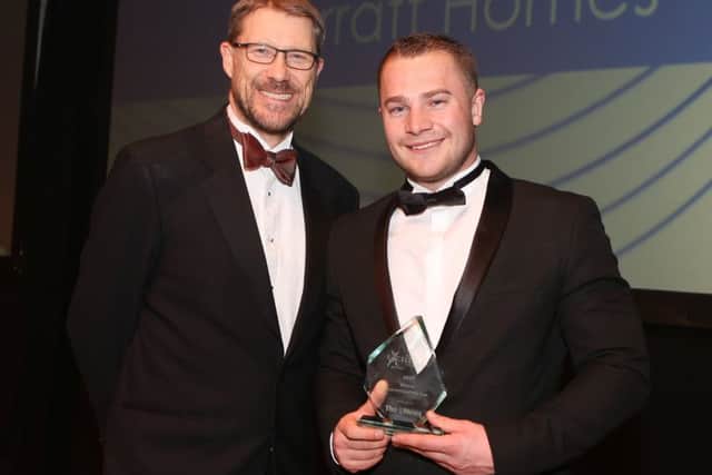 Mark Waldron, editor of The News, presents the Apprentice of the Year award to Peter Wilson from Barratt Homes at The News' Business Excellence Awards 2017 at Portsmouth Guildhall
