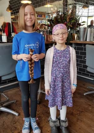 Cheryl Gibbs' niece Hollie, right, who has alopecia, and Amy Norton, 10, who cut her hair off for a wig-making charity