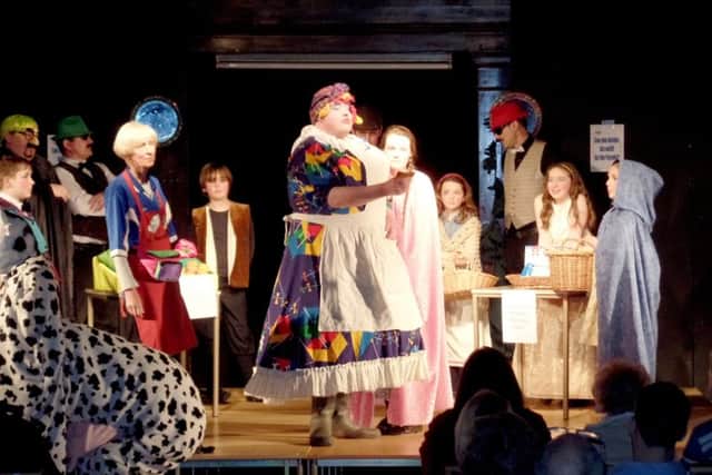 Canon Bob White, centre, dressing up for St Mary's parish pantomime. The panto takes place during February half-term every year.CAPTION: Canon Bob White, centre, dressed up for the parish pantomime