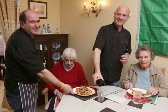 Fortunato Cappiello and Claudio Maresca serving the food to Cath Baxter and Martha Bellis. Picture by Habibur Rahman