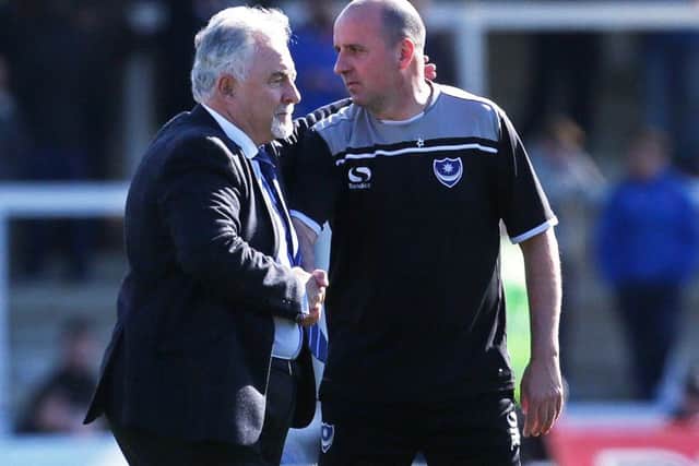 Pompey chairman Iain McIness, left, and Paul Cook, along with the Blues first-team squad, had to get a train from Carlisle to London Euston on Saturday after the team coach broke down
