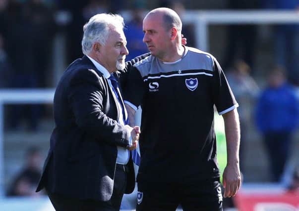 Pompey chairman Iain McIness, left, and Paul Cook, along with the Blues first-team squad, had to get a train from Carlisle to London Euston on Saturday after the team coach broke down