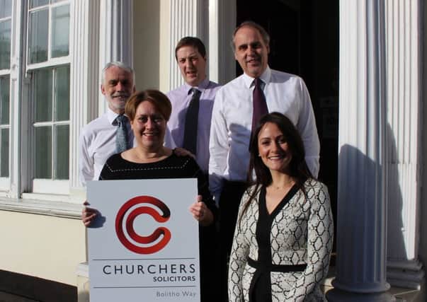 Lawyers from Churchers Solicitors with their new branding. (Left to right) managing partner Ian Robinson, Elizabeth Moger, Nick Eve, Matthew Bailey and Lauren McIntosh