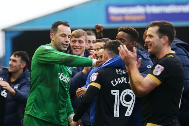 Will Pompey be enjoying more than victory against Morecambe tonight? Picture: Joe Pepler