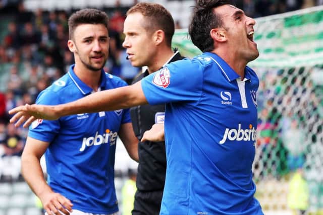 Referee Stephen Martin, centre, after Gary Roberts converted his penalty against Plymouth in August 2015 Picture: Joe Pepler
