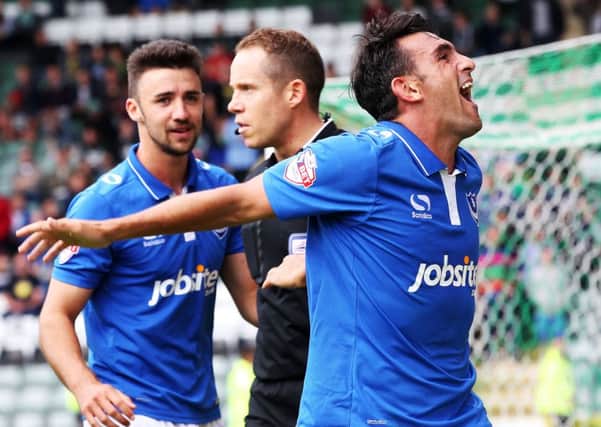 Referee Stephen Martin, centre, after Gary Roberts converted his penalty against Plymouth in August 2015 Picture: Joe Pepler