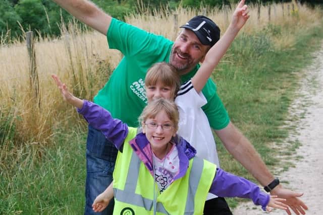 Kiernan Easton with his daughters at QE parkrun. Picture: Penny Johnstone