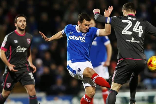 Michael Doyle battling against Morecambe. Picture: Joe Pepler