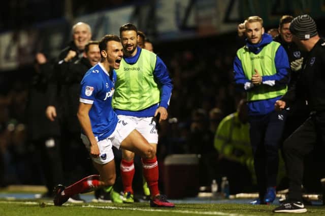 Paul Cook, right, celebrates with Kal Naismith who put Pompey ahead against Morecambe. Picture: Joe Pepler