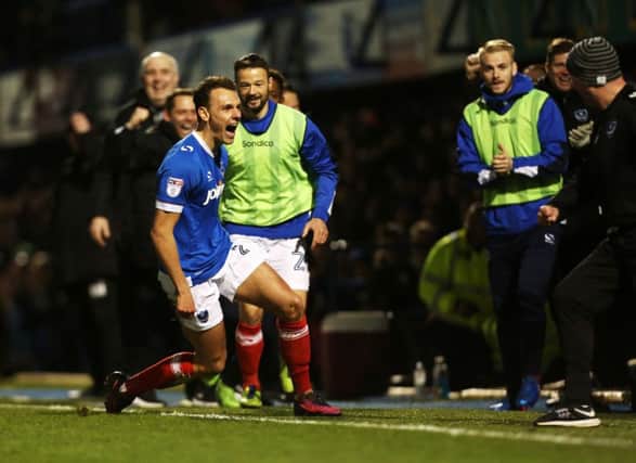 Paul Cook, right, celebrates with Kal Naismith who put Pompey ahead against Morecambe. Picture: Joe Pepler