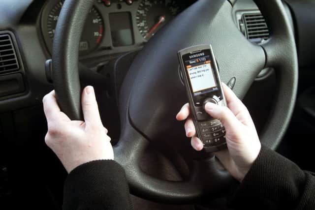 Tougher punishments introduced today for people using phones while driving