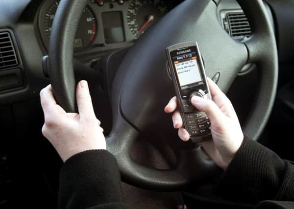Tougher punishments introduced today for people using phones while driving