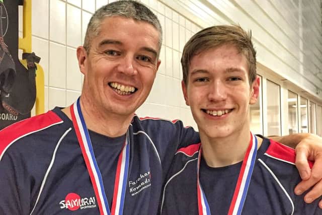 jpns-02-03-17-023 fare and gosp comm swimmer Andy GreenMasters swimmer Andy Green, left, with his son Adam, both from Fareham Nomads. The competitive swimming group recently held their Valentine's Open Meet, where 161 personal best times were beaten.CAPTION: Masters swimmer Andy Green, left, with his son Adam