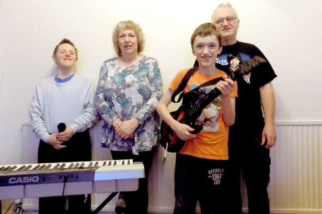 jpns-02-03-17-023 pmo COL Songs For Fun group PortsmouthFrom left, David Bidwell, Sheila Caudery, James Caudery and Phil Caudery at the Songs For Fun group in Portsmouth. The group aims to unite people with learning difficulties through music.CAPTION: From left, David Bidwell, Sheila Caudery, James Caudery and Phil Caudery