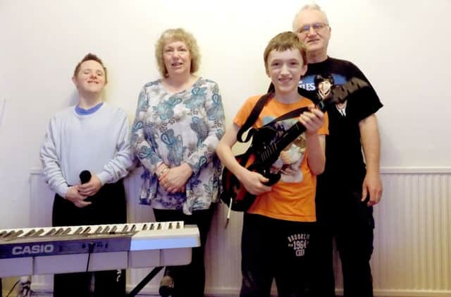 jpns-02-03-17-023 pmo COL Songs For Fun group Portsmouth

From left, David Bidwell, Sheila Caudery, James Caudery and Phil Caudery at the Songs For Fun group in Portsmouth. The group aims to unite people with learning difficulties through music.
CAPTION: From left, David Bidwell, Sheila Caudery, James Caudery and Phil Caudery