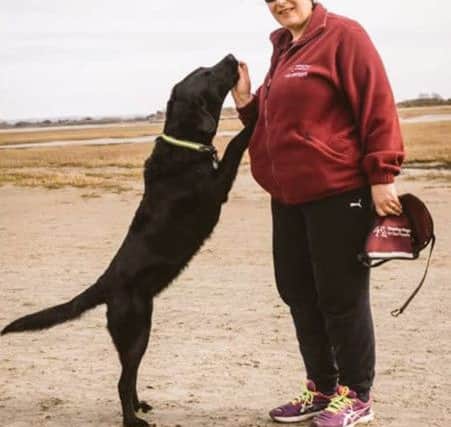 jons-02-03-17-023 pmo lead Hearing Dogs for Deaf Lisa BaldockLisa Baldock, right, and her dog Inca. Lisa has been nominated for a Hampshire High Sheriff Community Award for her work with Hearing Dogs for Deaf People and in the civil service.CAPTION: Lisa Baldock, right, and her dog Inca