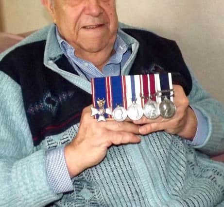 MEMORIES Ellis Norrell at his Portchester home