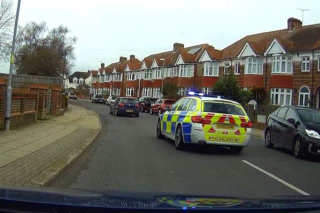 The police cars chasing the vehicle along Old Manor Way
