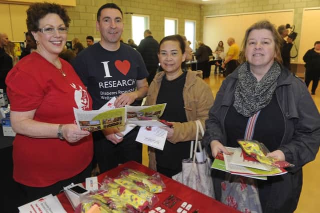 02/03/17  EPA free diabetic information event was held at The John Pounds Centre in Portsmouth. (left to right), Claire Levy and Lee Callidine from Wellbeing support talk to (centre), Phimchanok Mapson and Margaret Airey. Picture Ian Hargreaves  (170229-1) PPP-170203-204153006