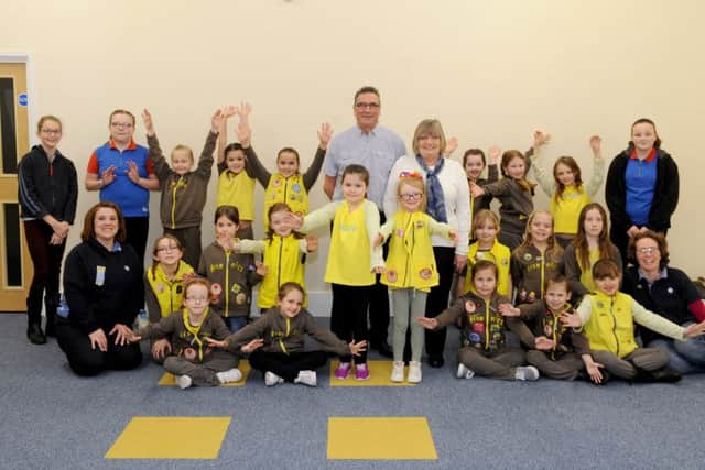 Stephen and Pauline Bailey, centre, meeting the Brownies