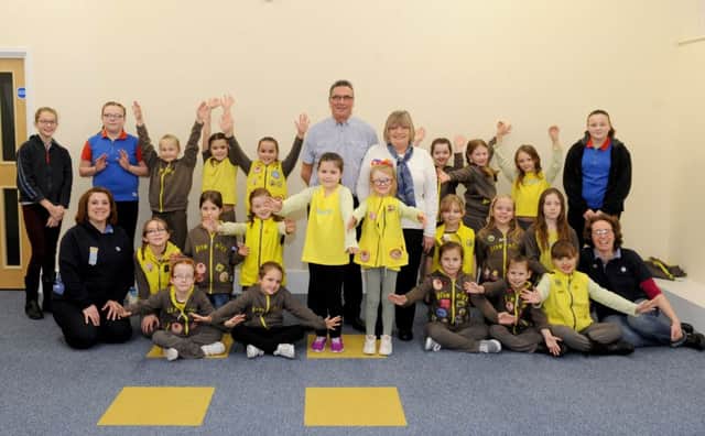 Stephen and Pauline Bailey, centre, meeting the Brownies
