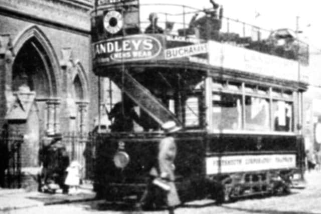 HOLD TIGHT A tram outside the church in Rugby Road, Southsea