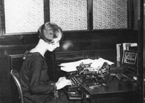CLICKETY-CLACK A typist in the 1920s. Imagine sitting in that chair all day?