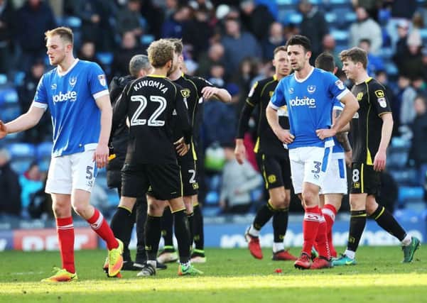 The Pompey players look distraught at the final whistle Picture: Joe Pepler