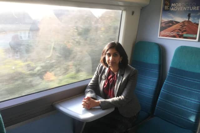Fareham MP Suella Fernandes on a Southern Rail train