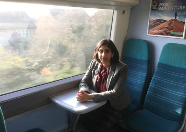 Fareham MP Suella Fernandes on a Southern Rail train