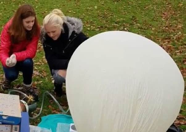 Rachel Barham and Issy George launch the weather balloon